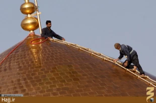 تصاوير شستشوي گنبد حرم مطهر امام رضا(ع)