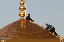 تصاوير شستشوي گنبد حرم مطهر امام رضا(ع)