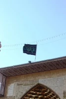 برافراشتن پرچم حرم مطهر رضوى بر افراز ايوان علوى