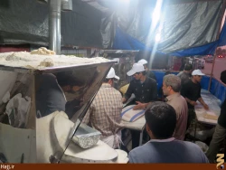 پخت نان نذري در كربلاي معلا + تصاوير
