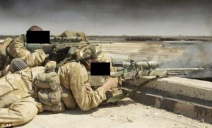 British special forces sniper kills ISIS bearded executioner seconds before he can behead Shiite father and son