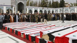 Syrians hold mass funeral for victims of Aleppo bombing
