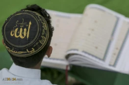 تصاویر ازآئین ترتیل خوانی قرآن توسط نوجوانان در حرم امام علی(ع) 10