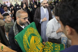با استقبال پرشور زائران حسینی؛
پرچم بارگاه منور رضوی به کربلا رسید 8