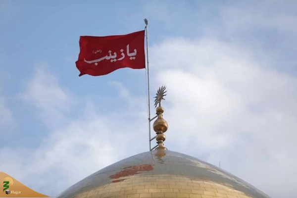 تعویض پرچم گنبد حرم حضرت زینب(س) 11
