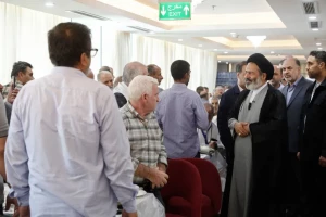 Head of the Iranian pilgrims listens to pilgrims' concerns at Kudi Tower 2 Hotel