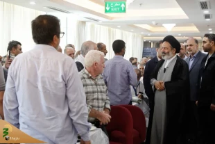 Head of the Iranian pilgrims listens to pilgrims' concerns at Kudi Tower 2 Hotel 2