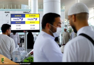 تصاویری از بازگشت اولین کاروان حاجیان ایرانی از عربستان به تهران 11